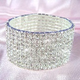 Браслет Swarovski (66 фото): модель зоряний пил, нова колекція з кристалами і камінням, жорсткий зі стразами і підвісками