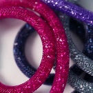 Браслет Swarovski (66 фото): модель зоряний пил, нова колекція з кристалами і камінням, жорсткий зі стразами і підвісками