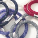 Браслет Swarovski (66 фото): модель зоряний пил, нова колекція з кристалами і камінням, жорсткий зі стразами і підвісками