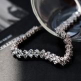 Браслет Swarovski (66 фото): модель зоряний пил, нова колекція з кристалами і камінням, жорсткий зі стразами і підвісками