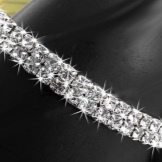 Браслет Swarovski (66 фото): модель зоряний пил, нова колекція з кристалами і камінням, жорсткий зі стразами і підвісками
