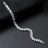 Браслет Swarovski (66 фото): модель зоряний пил, нова колекція з кристалами і камінням, жорсткий зі стразами і підвісками